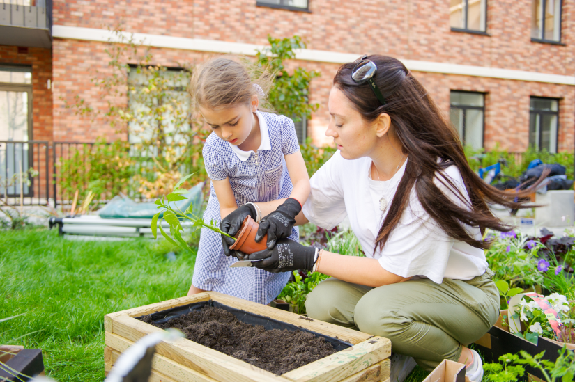 A mother and daughter gardening